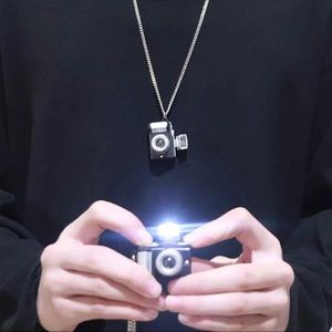 Camera with flash Necklace. Super cute!